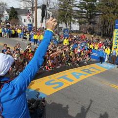 Jacqueline Benson shoots the starting piston for the elite womens start of the 117th running of the Boston Marathon